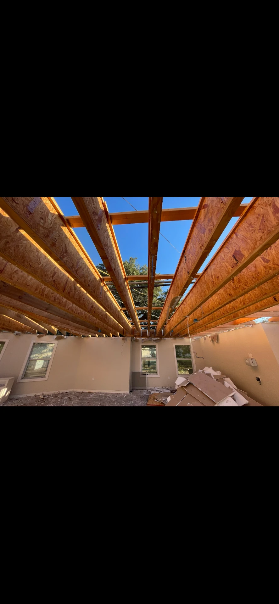 Interior demolition with exposed roof framing