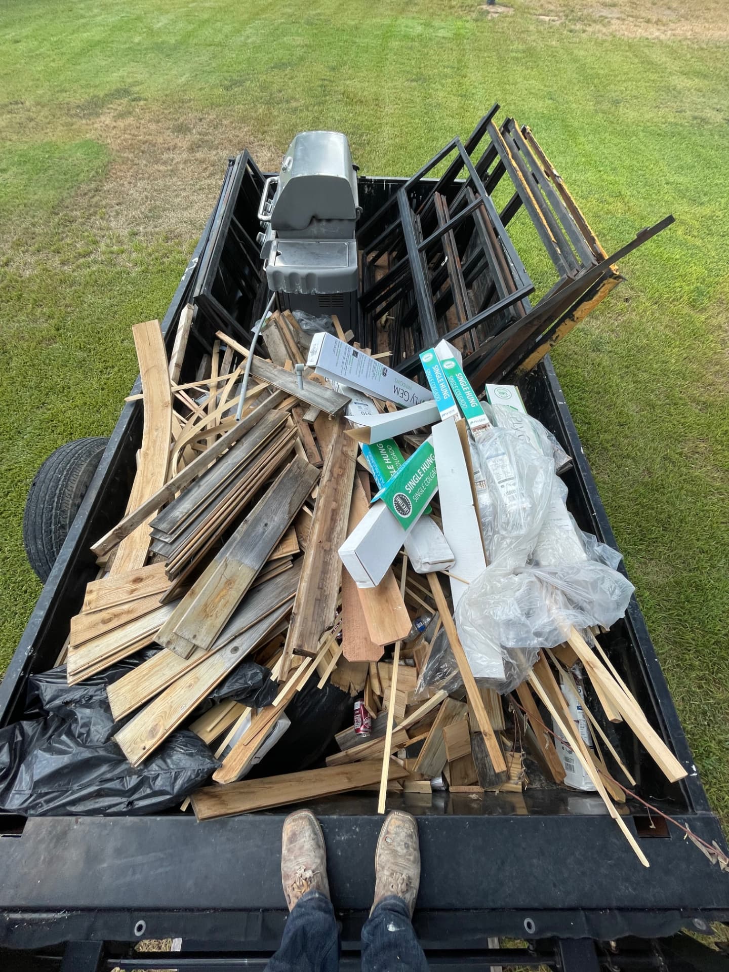 Trailer loaded with lumber and construction debris
